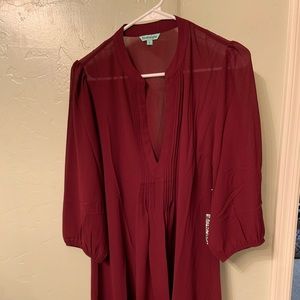 Long maroon colored top made from 100% polyester